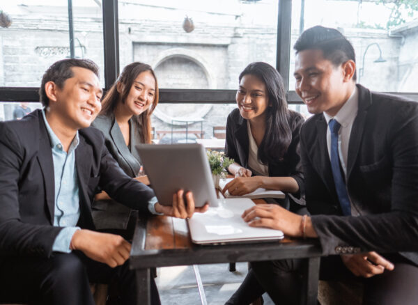 business people presentation when having a meeting in cafe business team presentation when having a meeting in cafe during lunch time