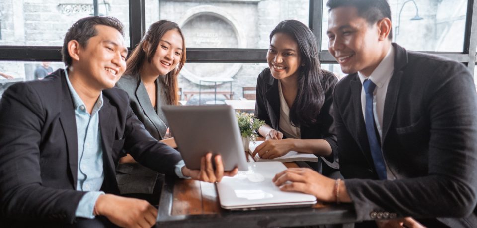 business team presentation when having a meeting in cafe during lunch time