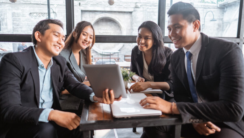 business team presentation when having a meeting in cafe during lunch time