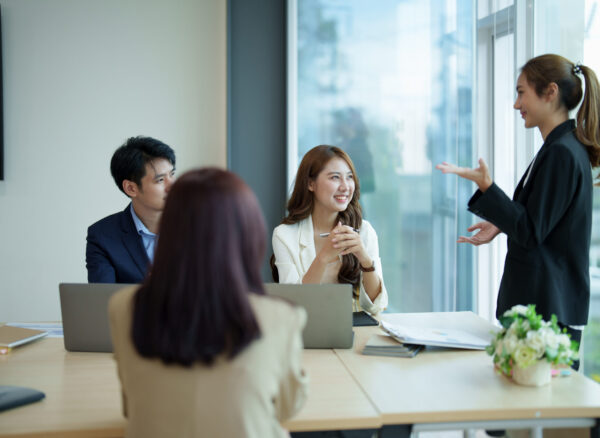 Group of asian business meeting and discussing with new startup idea project. Creative business people planning strategy analysis and brainstorm with document report in office Group of asian business meeting and discussing with new startup idea project. Creative business people planning strategy analysis and brainstorm with document report in office.