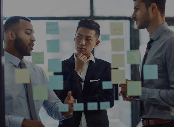 Shot of a group of young businesspeople having a brainstorming session together in a modern office.