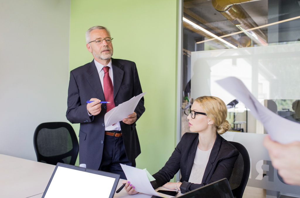 CEO and CFO rehearsing investor presentation preparation with an adviser